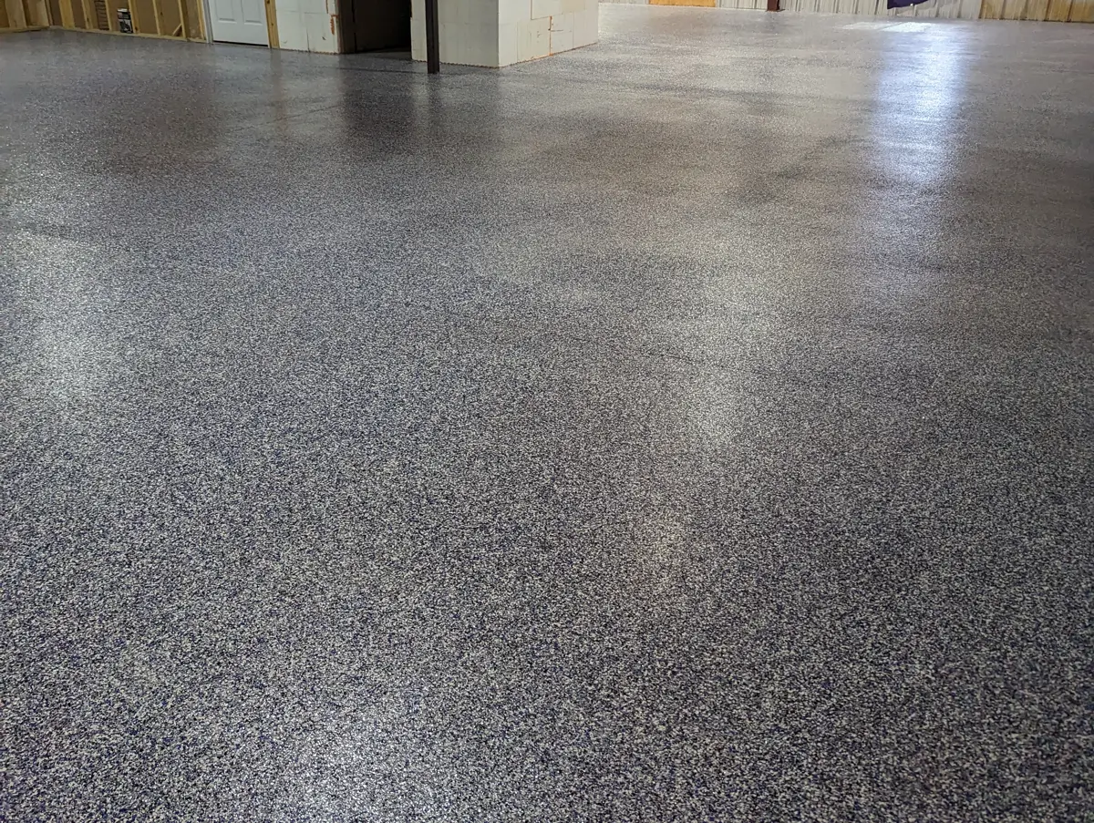 A broadcast decorative floor running through a large steel-framed commercial building