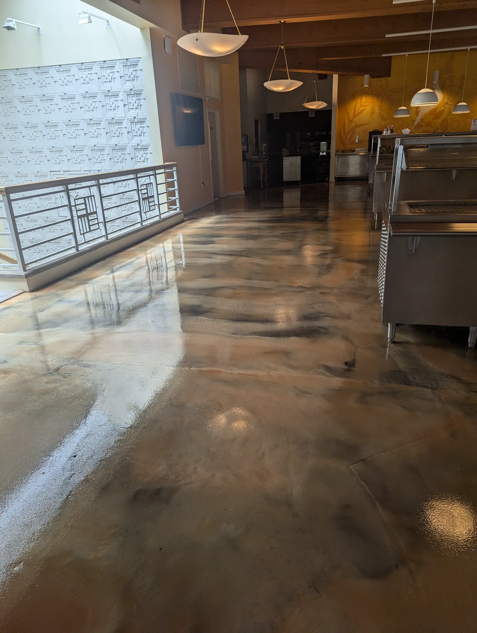 Finished decorative floor coating in a commercial dining and serving area