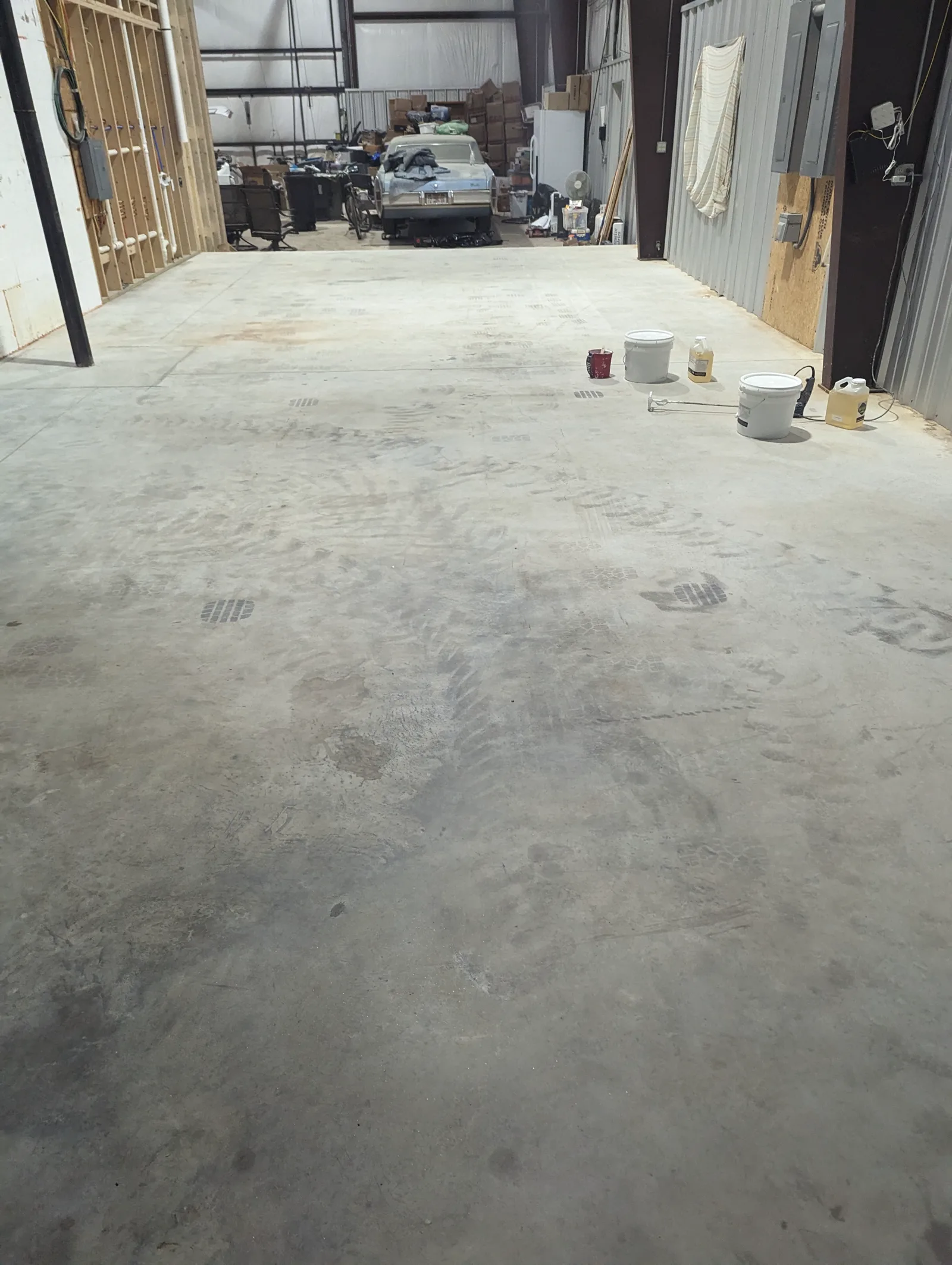 Old floor coating being removed during concrete surface preparation