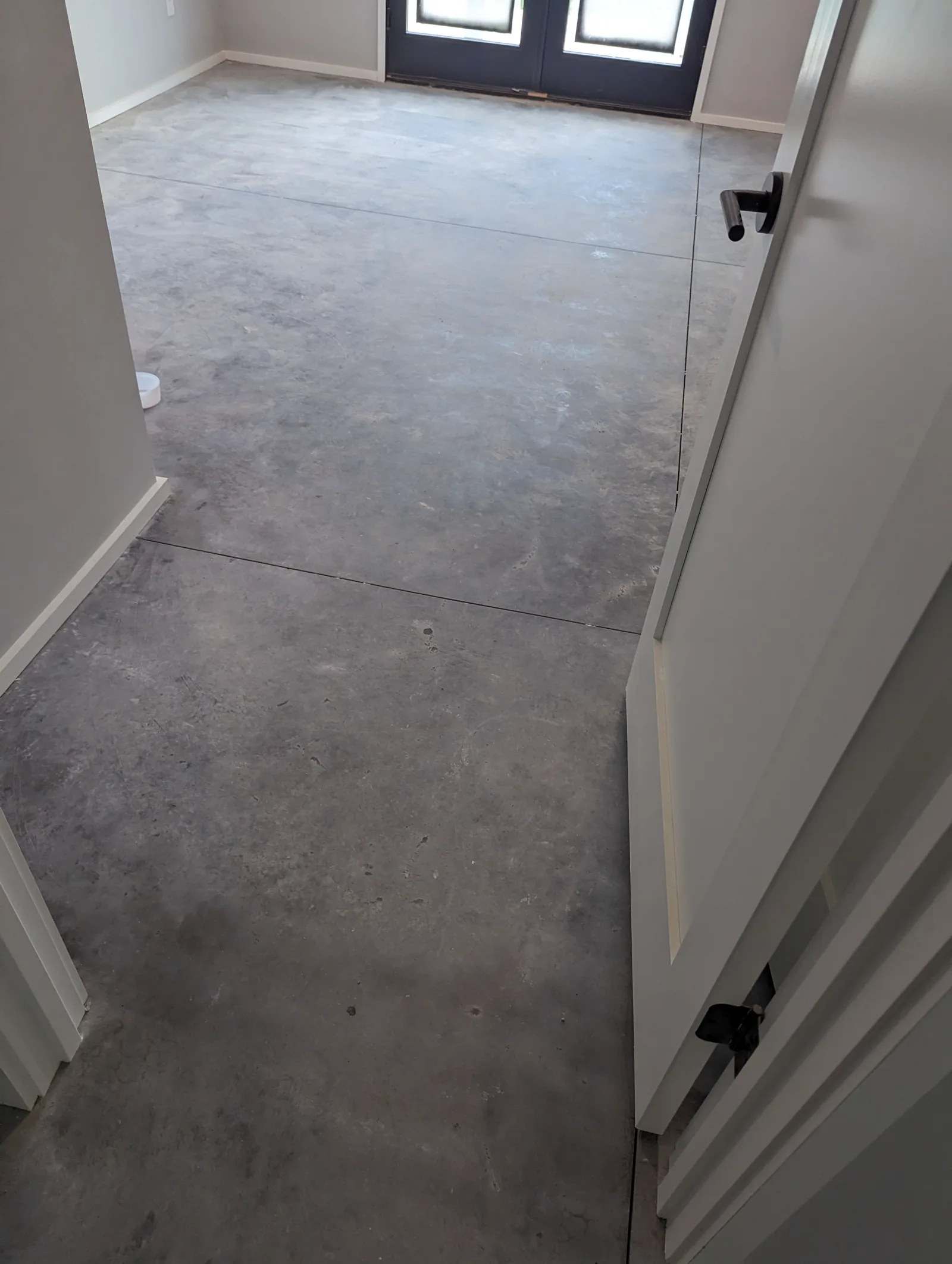 Bare concrete floor after grinding and surface preparation