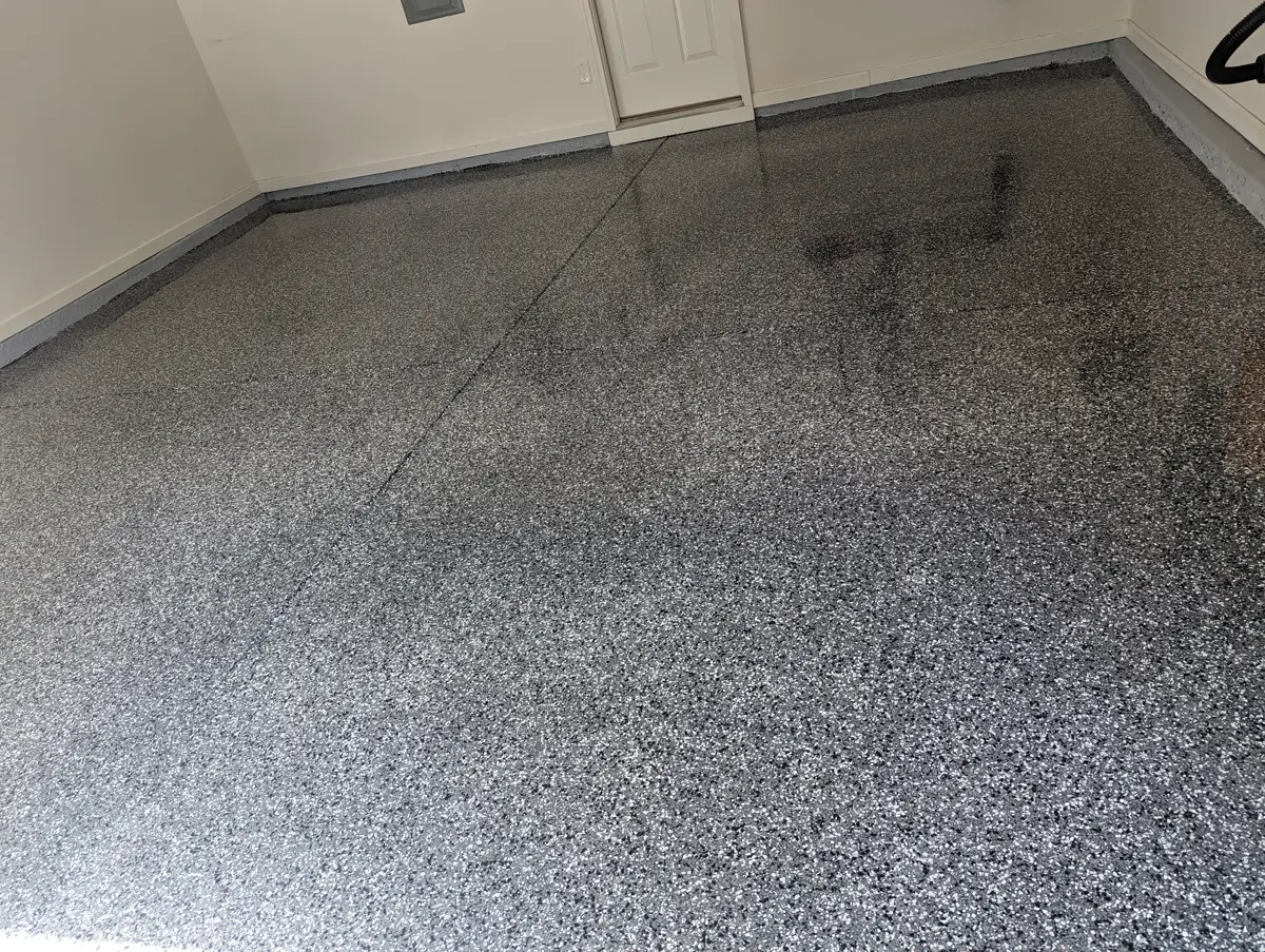 Finished residential garage floor with a decorative flake coating