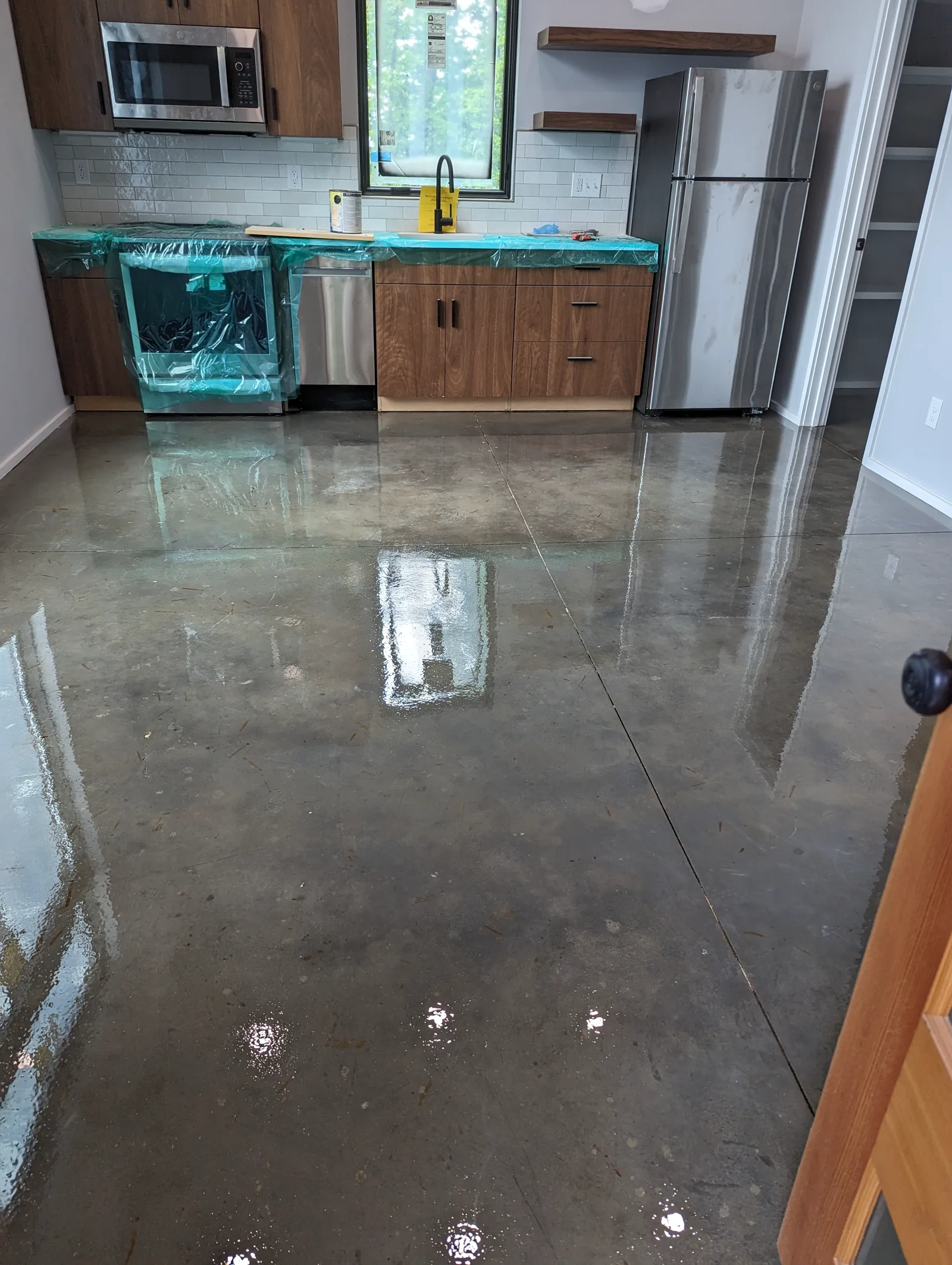 Clean finished residential epoxy floor in a kitchen space